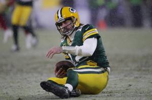 Green Bay Packers' Aaron Rodgers reacts after being sacked by San Francisco 49ers' Arik Armstead during the second half of an NFC divisional playoff NFL football game Saturday, Jan. 22, 2022, in Green Bay, Wis. (AP Photo/Aaron Gash)