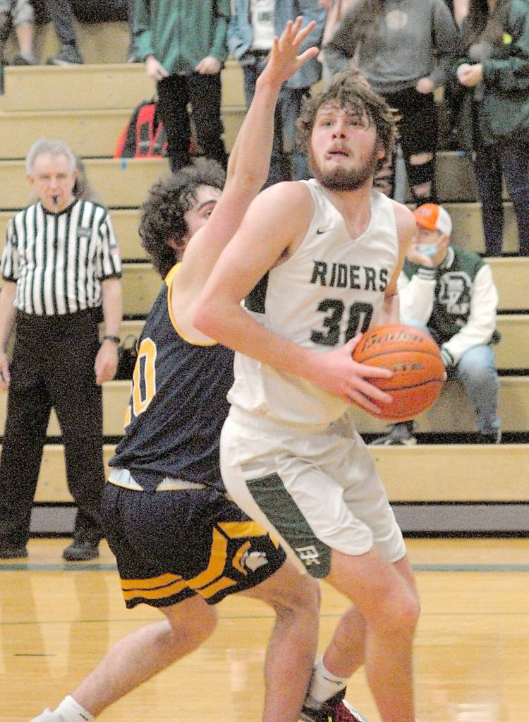 Port Angeles Wyatt Dunning, right, looks for an opening as he holds off the defense of Bainbridge Islands Ben Nylund on Tuesday in Port Angeles. (Keith Thorpe/Peninsula Daily News)