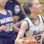 Keith Thorpe/Peninsula Daily News
Port Angeles' Isabelle Felton, right, sets her sights on the hoop while chased by North Kitsap's Ayanna Selembo on Thursday in Port Angeles.