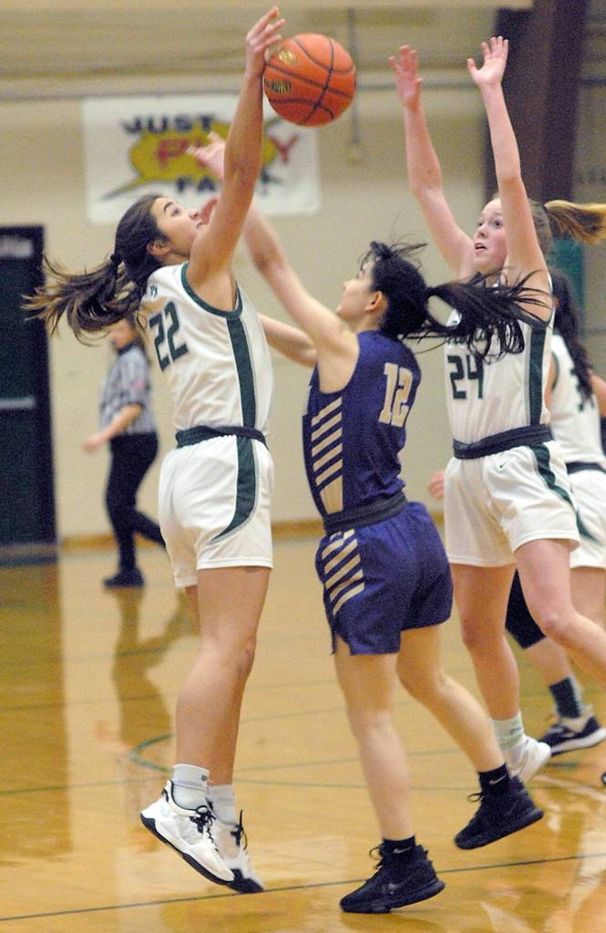 Keith Thorpe/Peninsula Daily News
Port Angeles' Eve Burke, left, and Anna Petty, right, surround North Kitsap's Jade Sunnenberg on Thursday night at Port Angeles High School.