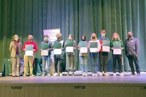 Pictured, from left to right, Annette Wendel, board member; Academic Achievement awardees James Saskowsky, Miles Wait, Damon Gunderson, Emi Halberg, Kimberly Thompson, Gillian Wolfe, Adam Weller and Joshua Gavin; and Ray Chirayath, board president.