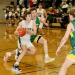 Port Angeles Parker Nickerson drives against Sehomes Grant Kepley on Friday night in Port Angeles. Nickerson scored 11 points in the third quarter to help spark a Roughriders comeback win. (Dave Logan/for Peninsula Daily News)
