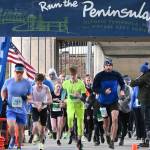 Michael Dashiell/Olympic Peninsula News Group
Participants in the Run the Peninsula's Elwha Bridge 5K/10K Run break from the starting line at the Elwha Bridge on Saturday morning.