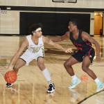 Peninsulas Roosevelt Williams Jr., left, holds off an Everett defender Brycen Dillworth in Saturdays game in Port Angeles. (Dave Logan/for Peninsula Daily News)