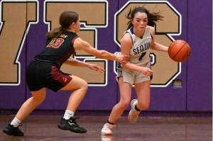 Sequim's Hannah Bates brings the ball up the court against Kingston in Sequim on Tuesday night. Sequim won the game 45-41. (Michael Dashiell/Olympic Peninsula News Group)