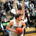 Keith Thorpe/Peninsula Daily News Port Angeles Wyatt Dunning, front, tries to evade the defense of North Kitsaps Jonas La Tour during Thursday nights game at Port Angeles High School.
