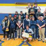 The Forks boys wrestling team celebrates winning the District 1 1B/2B Regional held in Adna this weekend. Forks had four weight division winners at regional — Jake Weakley, Hayden Queen, Sloan Tumaua and Conner Demorest.