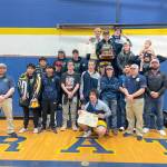 The Forks boys wrestling team celebrates winning the District 1 1B/2B Regional held in Adna this weekend. Forks had four weight division winners at regional  Jake Weakley, Hayden Queen, Sloan Tumaua and Conner Demorest. (Courtesy photo)