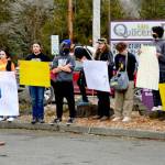 Quilcene High School principal Sean Moss, left, faces a group of students who walked out of class Tuesday afternoon, protesting what they say is a lack of support for students who have been sick with COVID-19. (Diane Urbani de la Paz/Peninsula Daily News)