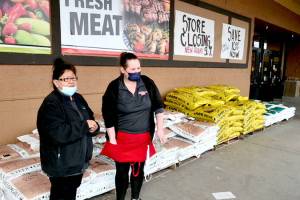 Saars employees Fekla Weldon, left, and Sara Hudson take a break on Weldons last day at the store, which will close in about five weeks. (Paul Gottlieb/Peninsula Daily News)