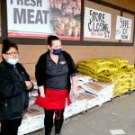 Saars employees Fekla Weldon, left, and Sara Hudson take a break on Weldons last day at the store, which will close in about five weeks. (Paul Gottlieb/Peninsula Daily News)