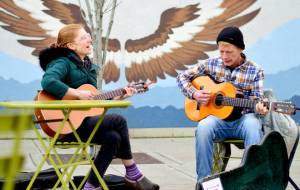 The local duo True Reckoning  AB McSpadden, left, and Tex Armstrong  play an acoustic set Friday afternoon at Tyler Street Plaza in downtown Port Townsend. The pair also performs at local clubs and plans to tour up Alaskas Inside Passage this summer. (Diane Urbani de la Paz/Peninsula Daily News)