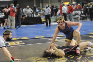 Forks' Hayden Queen defeats Jeshua Cwik in the 182-pound semifinals at the Mat Classic on Saturday.  Queen went on to later win the state championship at 182 pounds. (Lonnie Archibald/for Peninsula Daily News)