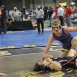 Forks Hayden Queen defeats Jeshua Cwik in the 182-pound semifinals at the Mat Classic on Saturday. Queen went on to later win the state championship at 182 pounds. (Lonnie Archibald/for Peninsula Daily News)
