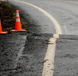 Pictured is a portion of the damaged roadway on state Highway 112 near Neah Bay. (state Department of Transportation)