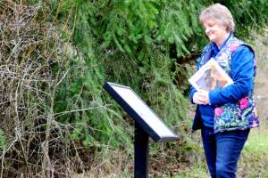 Jan Jacobson of the Port Townsend Library helped choose Seyas Song, the current StoryWalk at Kah Tai Lagoon in Port Townsend. Seyas Song is a book that contains SKlallam words in its story about the people and wild creatures of the North Olympic Peninsula. (Diane Urbani de la Paz/Peninsula Daily News)