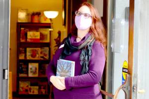 Port Townsend Library Director Melody Sky Weaver is presiding over the 2022 Community Read, which includes two books this year: Wishtree by Katherine Applegate and The House in the Cerulean Sea by TJ Klune. (Diane Urbani de la Paz/Peninsula Daily News)