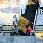 As a bright sun shines on a snow-garlanded Haller Fountain, Port Townsend City Engineer Laura Parsons makes her way to work Thursday morning. (Diane Urbani de la Paz/Peninsula Daily News)