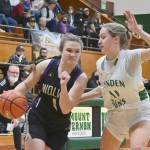 Sequim's Addie Smith drives around Lynden's Mallary Villars in the state 2A regional game held Friday night in Mount Vernon. (Michael Dashiell/Olympic Peninsula News Group)
