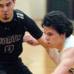 Keith Thorpe/Peninsula Daily News
Port Angeles' Xander Maestas, front, drives past North Kitsap's Johny Olmsted on Thursday night in Port Angeles.