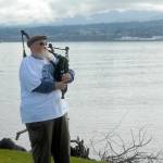 Erik Evans of Port Angeles, otherwise known as the Parking Lot Piper, gives a free bagpipe performance on Tuesday at Sail and Paddle Park on Ediz Hook in Port Angeles. (Keith Thorpe/Peninsula Daily News)