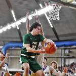 Jordan Nailon/The Daily News Port Angeles Xander Maestas drives during the Roughriders 75-58 Class 2A state quarterfinal loss to North Kitsap on Thursday night at the Yakima Valley SunDome.