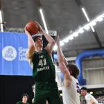 Jordan Nailon/The Daily News Port Angeles John Vaara puts up a shot over North Kitsaps Colton Bower during the Roughriders 75-58 Class 2A state quarterfinal loss Thursday at the Yakima SunDome