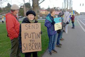 Phil Lusk
Marga Kapka of Port Townsend was among the 75 people who gathered at the corner of East Sims Way and Kearney Street in Port Townsend late Thursday to show solidarity with the people of Ukraine. Her Hungarian parents fled Budapest in July 1945 to escape the brutality of the Soviets who had liberated the city from the Nazis earlier that year, she said. Another rally is planned at 2 p.m. today at the intersection of Washington and Taylor Streets in Port Townsend.