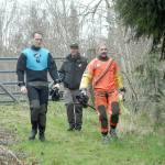 Keith Thorpe/Peninsula Daily News
Clallam County Sheriff's deputies Dylan Heck, left, and Hector Eagan, right, accompanied by Sgt. John Keegan, prepare to search for evidence on Friday in a section of nearby Siebert Creek in the Feb. 24 double homicide east of Port Angeles.