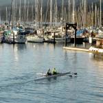 Karlena Brailey, left, and Becky Godby, both of Sequim, paddle into John Wayne Marina near Sequim on Wednesday after rowing on the waters of Sequim Bay. The pair said it was a pleasant morning for rowing in a double scull. (Keith Thorpe/Peninsula Daily News)