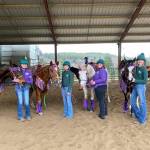 Preparing for the Drill Team competition at the WAHSET district four second meet are, from left, Libby Swanberg , Sydney Hutton, Joanna Seelye and Maggie Anderson. (Photo by Keri Tucker)