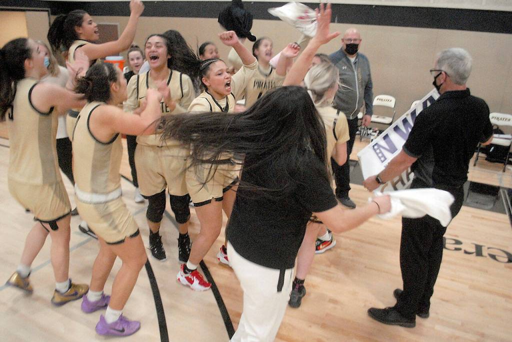Keith Thorpe/Peninsula Daily News
Members of the Peninsula College womens basketball team celebrate after defeating Shoreline on Wednesday, earning them the NWAC North Region title.