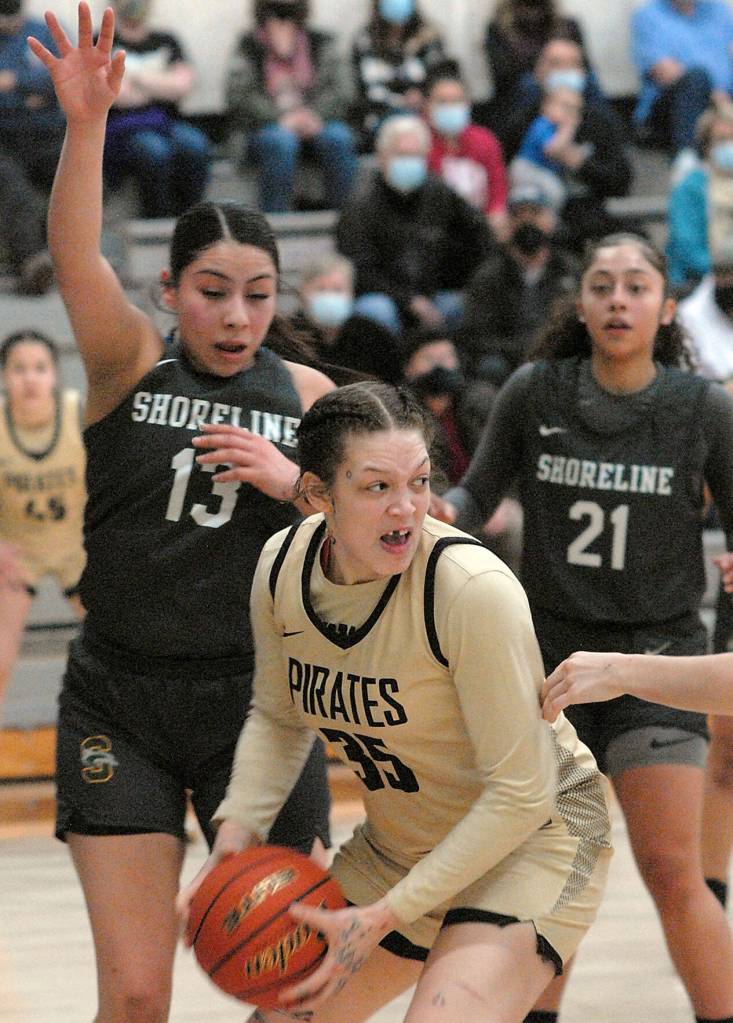 Peninsulas Madison Cooke, center, looks for a way around the defense of Shorelines Kimberly Perez, left, as Shorelines Kyla Miller looks on during Wednesdays game in Port Angeles. (Keith Thorpe/Peninsula Daily News)