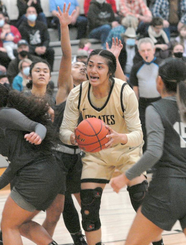Peninsulas Ituau Tuisaula finds herself surrounded by the Shoreline defense during Wednesdays game in Port Angeles. (Keith Thorpe/Peninsula Daily News)