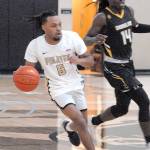 Keith Thorpe/Peninsula Daily News
Peninsula's Rayshawn Harris, left, outraces Shoreline's A.J. Boyd during Wednesday's game at Peninsula College.
