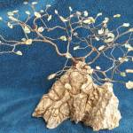 This Ming gem tree designed and made by Terry Stockman, Clallam County Gem & Mineral Association president, is one of several raffle items at the clubs annual show set for March 19-20 in Port Angeles. The gemstones are Sun Stones.