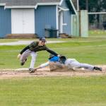Steve Mullensky/for Peninsula Daily News
East Jefferson Rival Nathan Nisbet tags safe at third before the ball reached Quilcene’s third baseman Aiden Kate during a non-league game played in Chimacum on Monday. East Jefferson won the game 11-4.