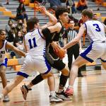 Peninsula Colleges KeAndre Hunter-Holiday, center, is swarmed by Lane Titans defenders during the Pirates 82-68 NWAC Tournament loss on Thursday at Everett Community College. (Jay Cline/Peninsula College Athletics)