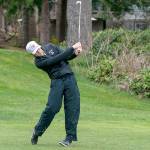 Steve Mullensky/for Peninsula Daily News
Sequim’s Dom Riccobene drives the ball with an iron on the second hole at Port Ludlow Golf Course during a match Thursday against the North Kitsap Vikings.