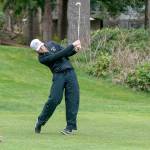 Sequims Dom Riccobene drives the ball with an iron on the second hole at Port Ludlow Golf Course during a match Thursday against the North Kitsap Vikings. (Steve Mullensky/for Peninsula Daily News)