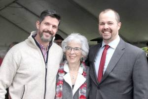 From left, Chris Cahall, Betsy Reed Schultz and Jody Pinkelman were among about 200 in attendance Sunday for the dedication of the Captain Joseph House. A large tent covered the ceremony on south Oak Street, and Cahall and Pinkelman, both retired from the U.S. Special Forces, shared their experiences as they served with Captain Joseph Schultz, who was killed in Afghanistan in 2011. The house will serve as a place of rest for Gold Star families. (Dave Logan/for Peninsula Daily News)
