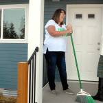 Keith Thorpe/Peninsula Daily News
Habitat for Humanity of Clallam County CEO Colleen Robinson, left, talks with Julie Maron, the organization's family resource manager, on the porch of a completed Habitat house on Maloney Court in Port Angeles on Thursday.