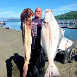 Olympic Chapter of Salmon for Soliders member Daniel Goettling caught this halibut and lingcod while fishing with a group of military veterans last summer. Halibut fishing begins April 7 in Marine Areas 6-10.
