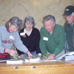 Clallam County master gardeners, from left to right, Jeanette Stehr-Green, Cindy Erickson, Nye Nelson and John Norgord discussing a problem with a hemlock tree during a plant clinic.