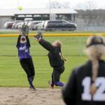 Sequim shortstop Hannah Bates, left, and second baseman Addie Smith converge on an infield fly ball during the Wolves 8-6 loss to North Kitsap on Tuesday. (Michael Dashiell/Olympic Peninsula News Group)