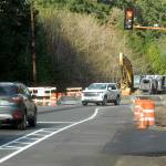 Traffic waits at a temporary stoplight controlling a one-lane temporary bridge that bypasses a construction zone on U.S. Highway 101 at Indian Creek west of Port Angeles on Saturday. (Keith Thorpe/Peninsula Daily News)