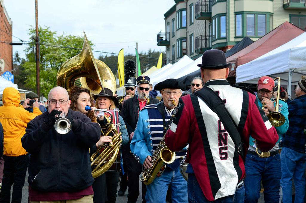 The Unexpected Brass Band plays its way through the opening-day crowd at the Port Townsend Farmers Market on Saturday. (Diane Urbani de la Paz/Peninsula Daily News)