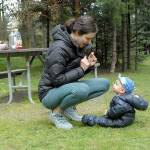 Anna Brady of Kingston shares a moment with her son, Owen, 9 months, after a picnic lunch at Robin Hill Farm County Park west of Sequim over the weekend. The lunch was a prelude to a family bike ride on the Olympic Discovery Trail. (Keith Thorpe/Peninsula Daily News)