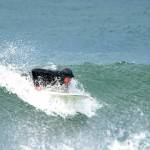 Steve Mullensky/for Peninsula Daily News

A surfer starts to get up on his board to catch a nice 5 foot wave that was formed by high winds and tide at Port Townsend’s Point Hudson beach on Monday morning.