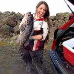 Britney Robinson found success, including this massive 24-inch black rockfish and a pair of lingcod while fishing the jetty at the Neah Bay marina recently. (Courtesy photo)